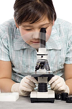 Girl with microscope.