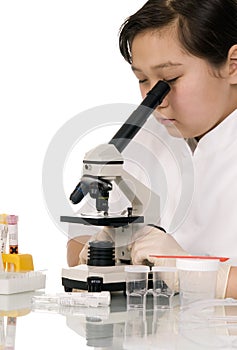 Girl with microscope.
