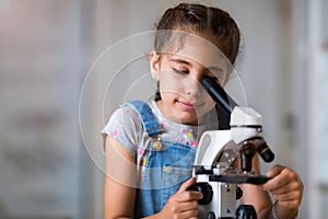 Girl with microscope