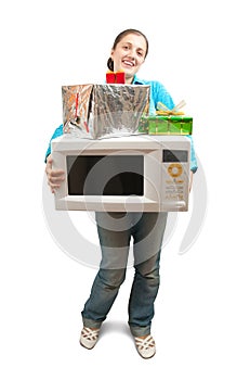 Girl with microwave oven and gifts