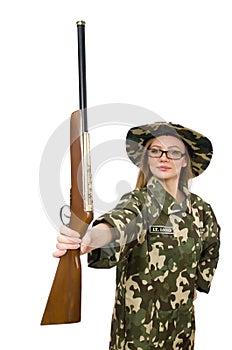 The girl in military uniform holding the gun isolated on white