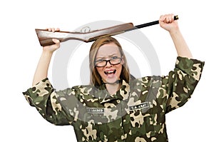 The girl in military uniform holding the gun isolated on white