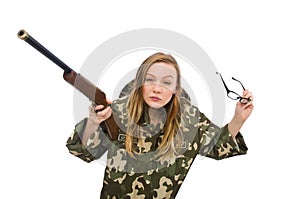 The girl in military uniform holding the gun isolated on white