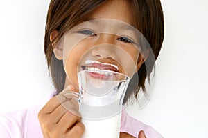 Girl with milk moustache photo