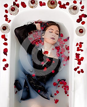 Girl milk water bath red roses candles