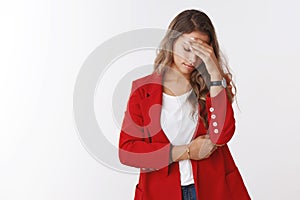 Girl missed lucky chance regretting making facepalm gesture, holding hand forehead look down gloomy upset, sad