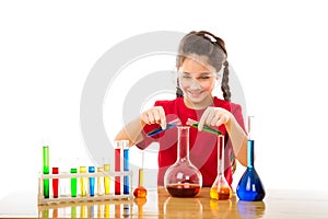 Girl mixes chemicals in a flask
