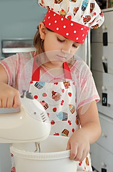 Girl mixing ingredients for a cake