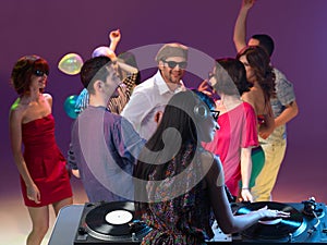 Girl mixing music at party