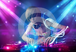 girl mixing music with powerful light effects