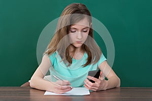 Girl With Mobile Phone And Books