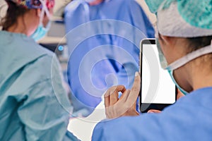 girl with mobile phone in surgery room