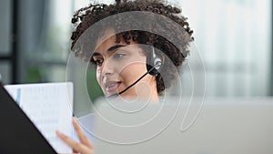 girl in a modern office working in a call center smiling