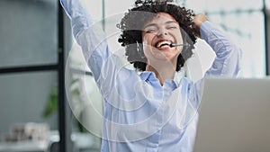 girl in a modern office working in a call center smiling