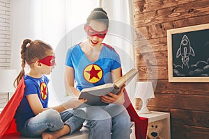 Girl and mom in Superhero costume