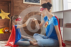 Girl and mom in Superhero costume