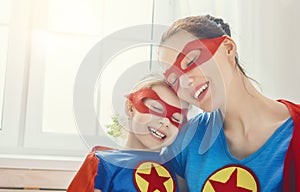 Girl and mom in Superhero costume