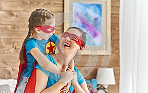 Girl and mom in Superhero costume