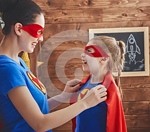 Girl and mom in Superhero costumes