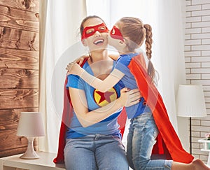 Girl and mom in Superhero costumes