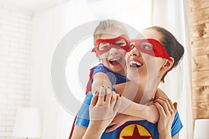 Girl and mom in Superhero costumes