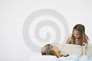 Girl With Mother Spending Quality Time At Home