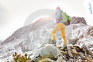 Girl on mountain ledge