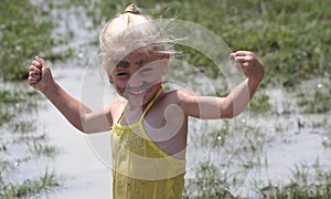 Girl in muddy water photo