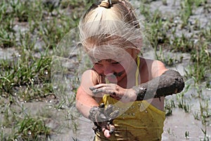 Girl in muddy water photo