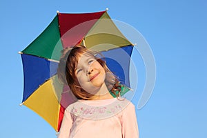 Girl with multicolor rainbow umbrella