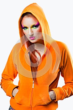 Girl with multicolored make up and orange jacket