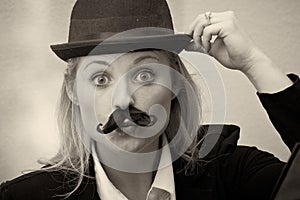 Girl with mustache and bowler hat