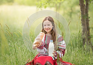 a girl in a national Belarusian costume