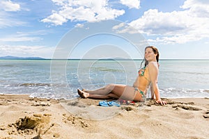 Girl at the natural beach Cala di Forno in Italy