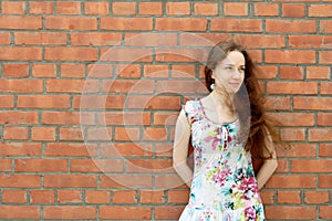 Girl near the brick wall