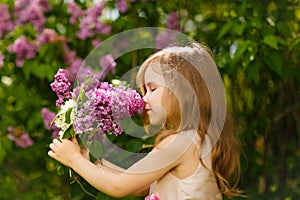 Girl near lilac flowers snuff bouquet