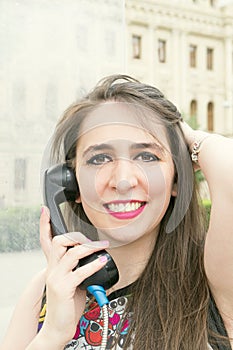 Girl near a phone booth