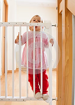 Girl near stair gate