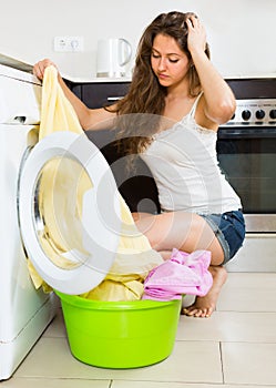 Girl near washing machine
