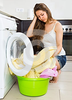 Girl near washing machine