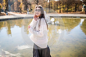 Girl near water over fountain background