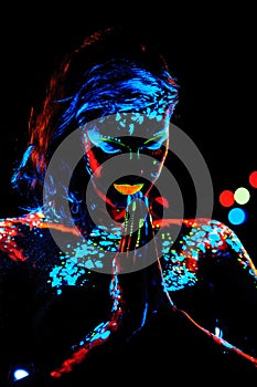 Girl with neon paint body art portrait