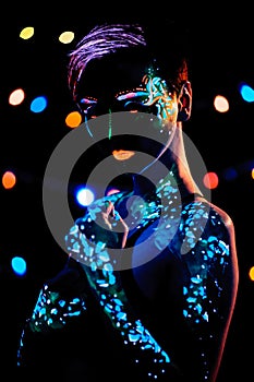 Girl with neon paint body art portrait