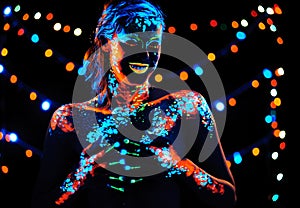 Girl with neon paint bodyart portrait