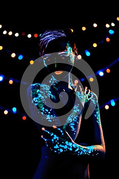 Girl with neon paint bodyart portrait