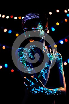 Girl with neon paint bodyart portrait