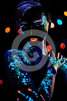 Girl with neon paint bodyart portrait