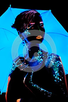 Girl with neon paint bodyart portrait