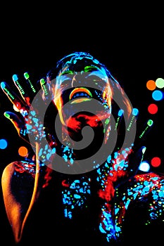 Girl with neon paint bodyart portrait