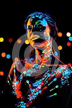 Girl with neon paint bodyart portrait